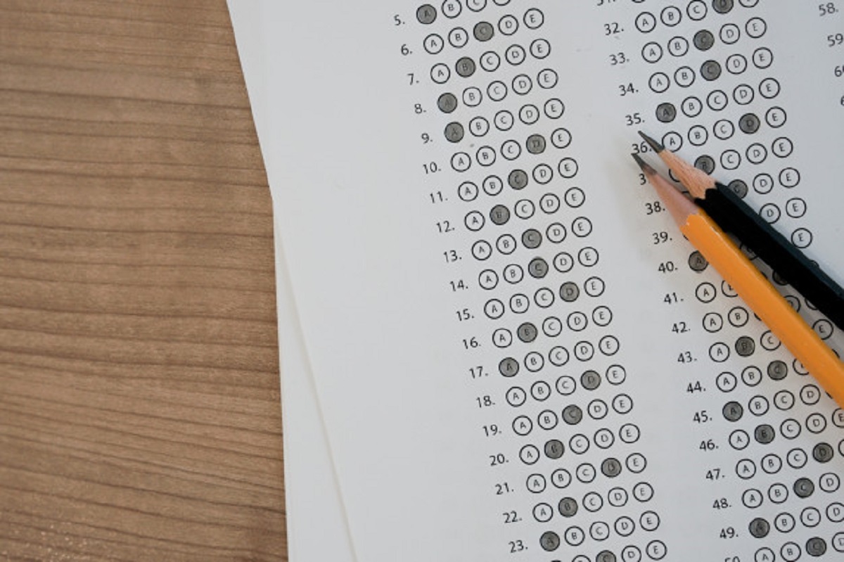 close-up-top-view-black-pencil-exam-answer-sheet-paper_42708-380