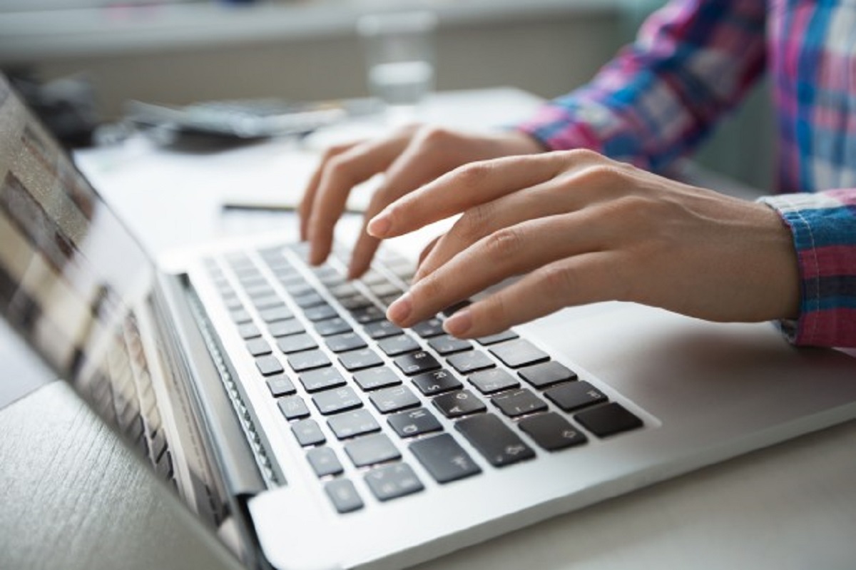 cropped-view-hands-typing-laptop_1262-3196