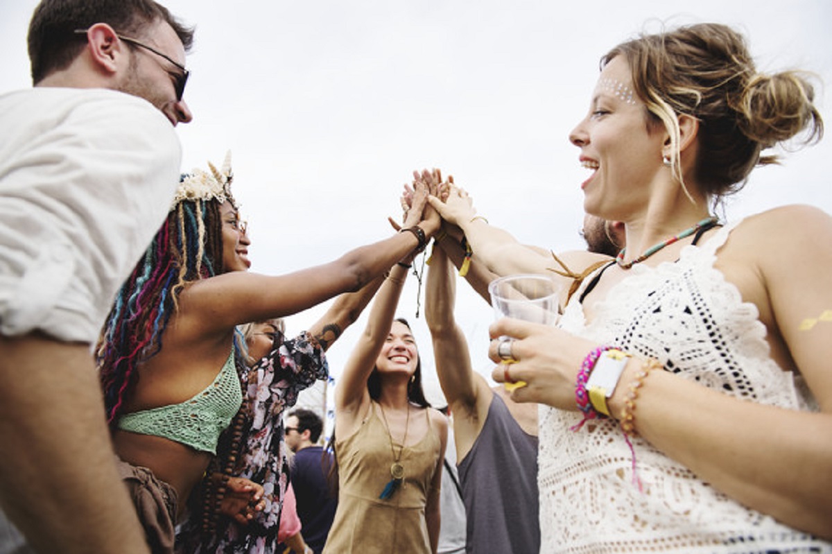 Group of Friends and Beers Enjoying Music Festival together