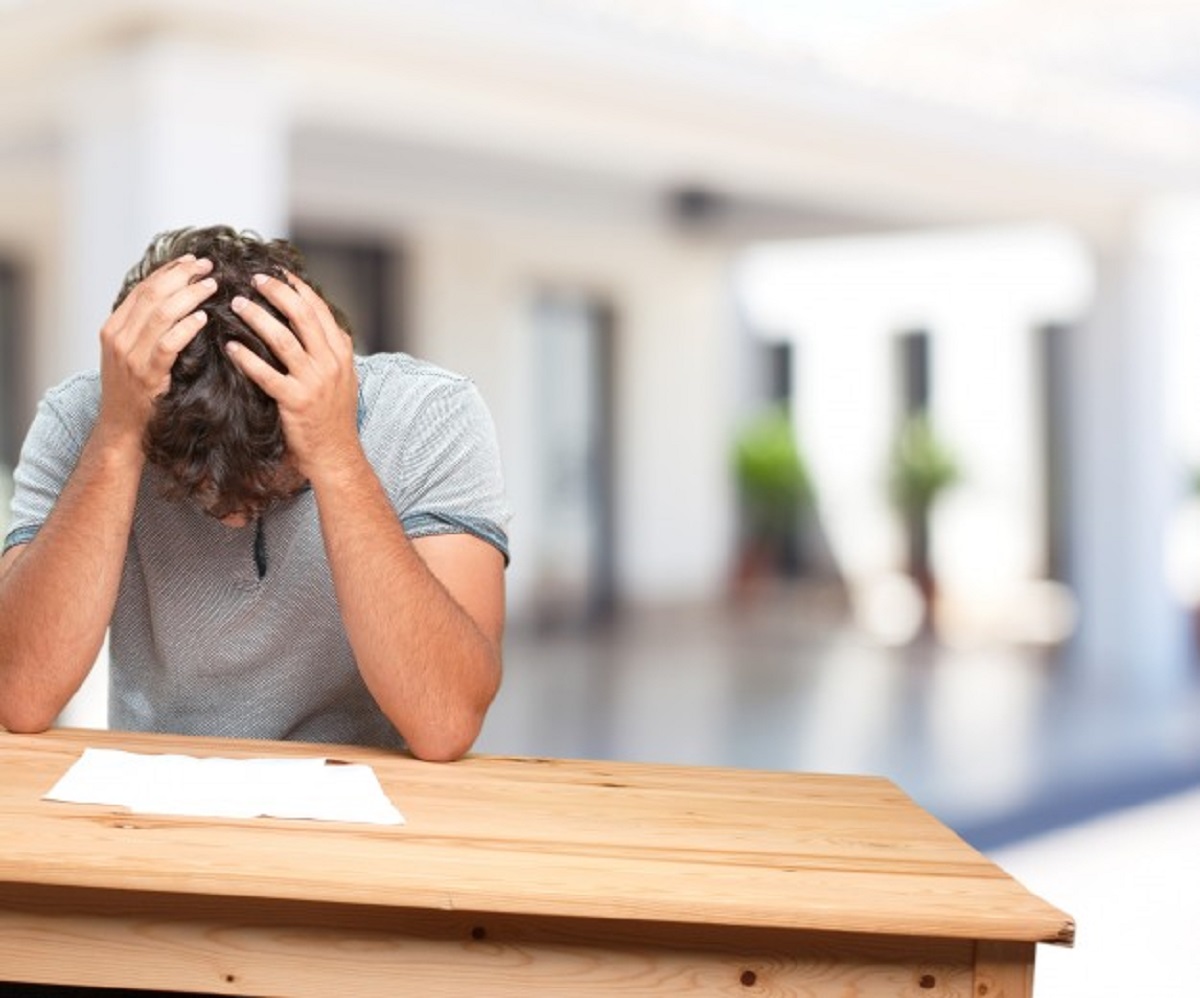 young-man-table-worried-expression_1194-4582