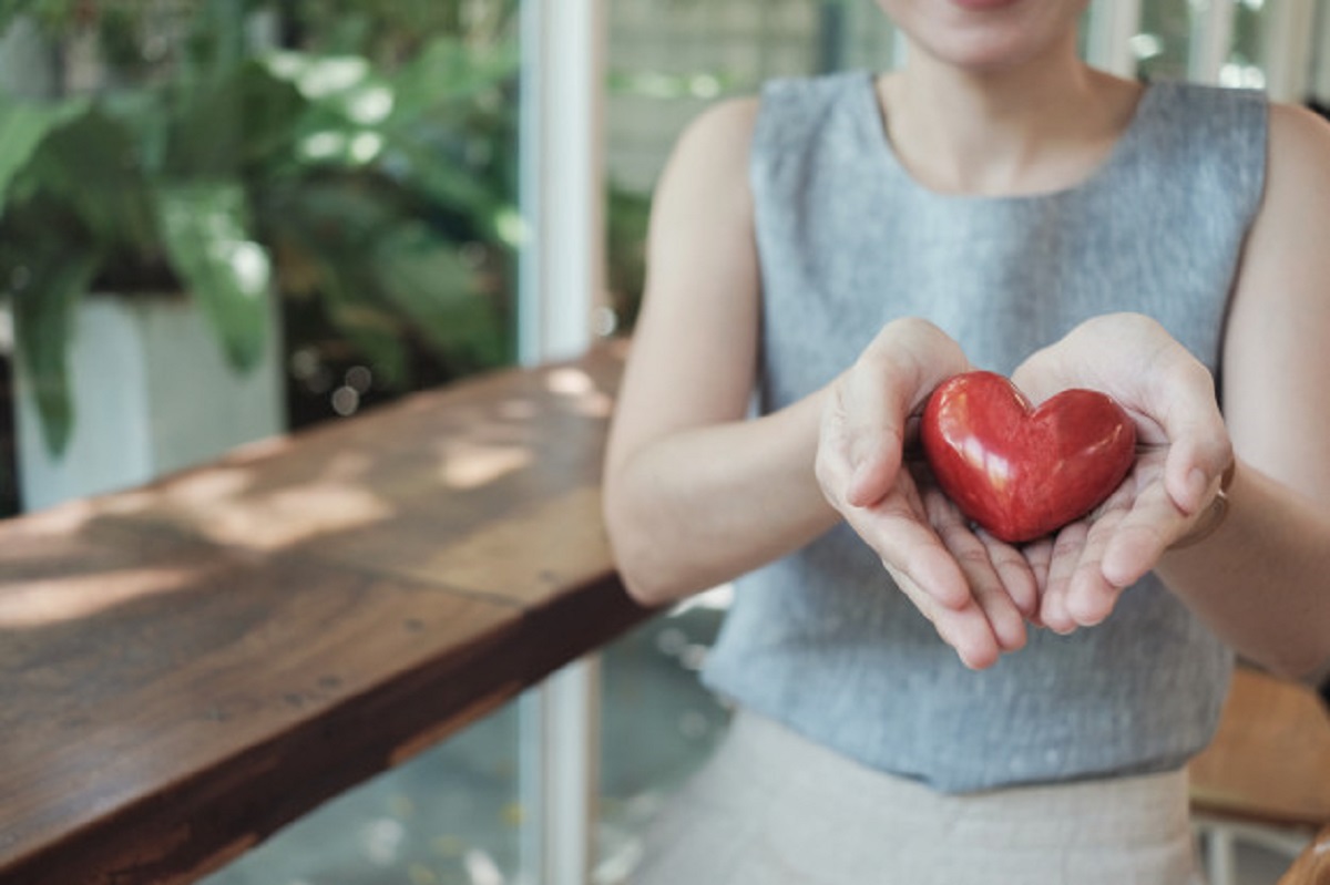 asian-woman-holding-red-heart-health-insurance_49149-845