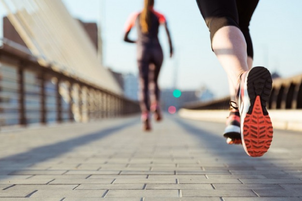 close-up-woman-running-with-unfocused-background_23-2147600468