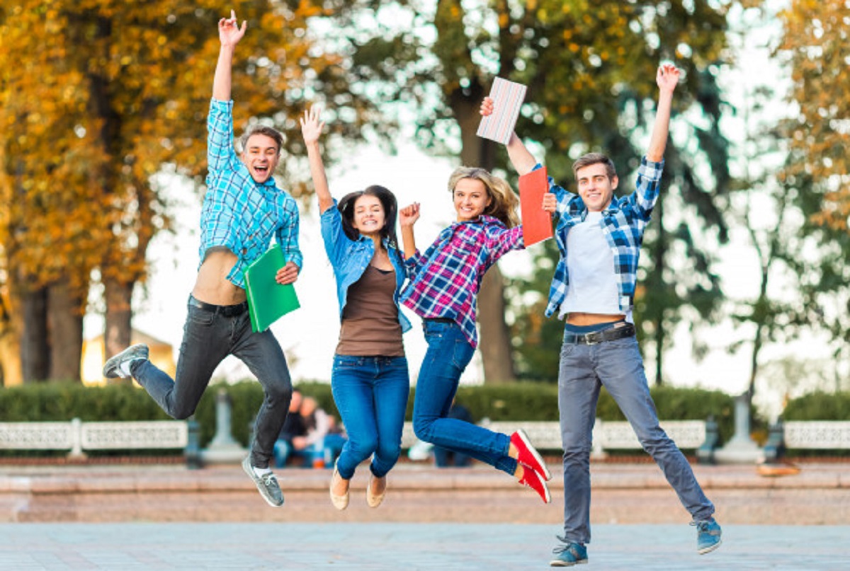 funny-young-students-are-jumping-together-park_85574-707